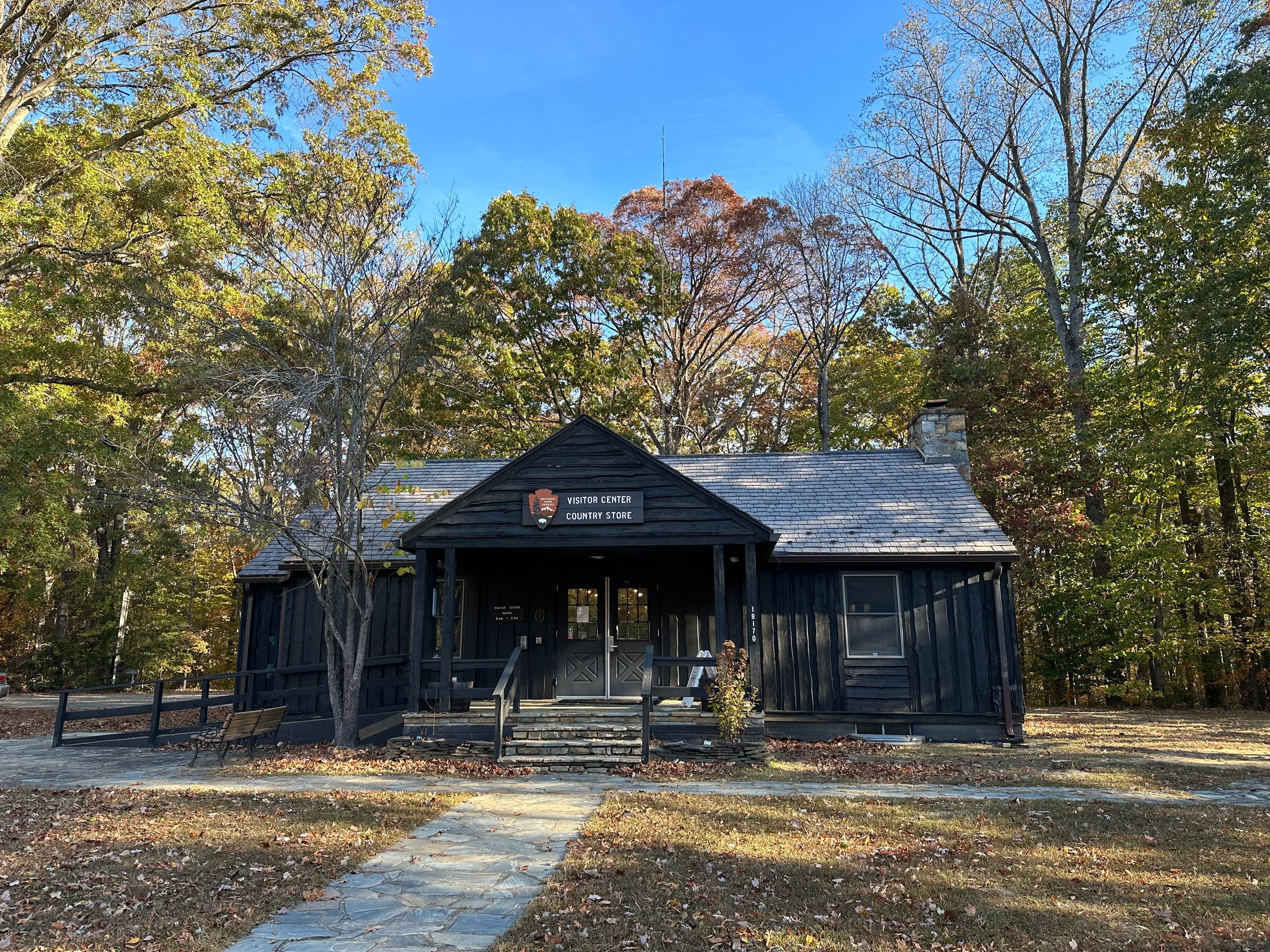 A visitor center building surrounded by trees